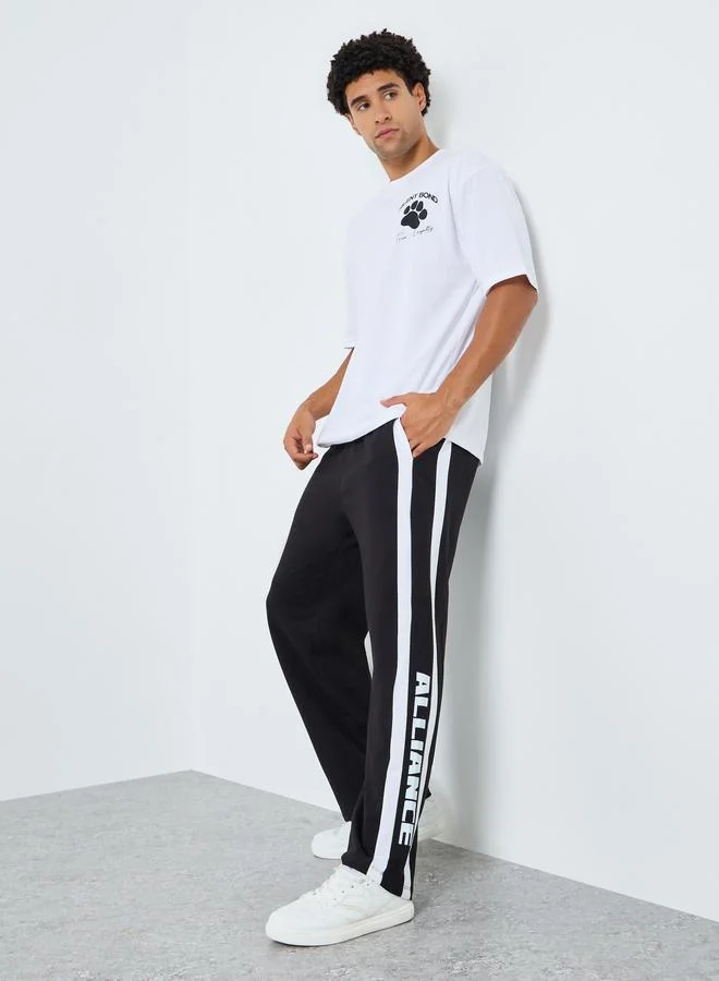 Men Oversized Terry Side Tape Printed Joggers